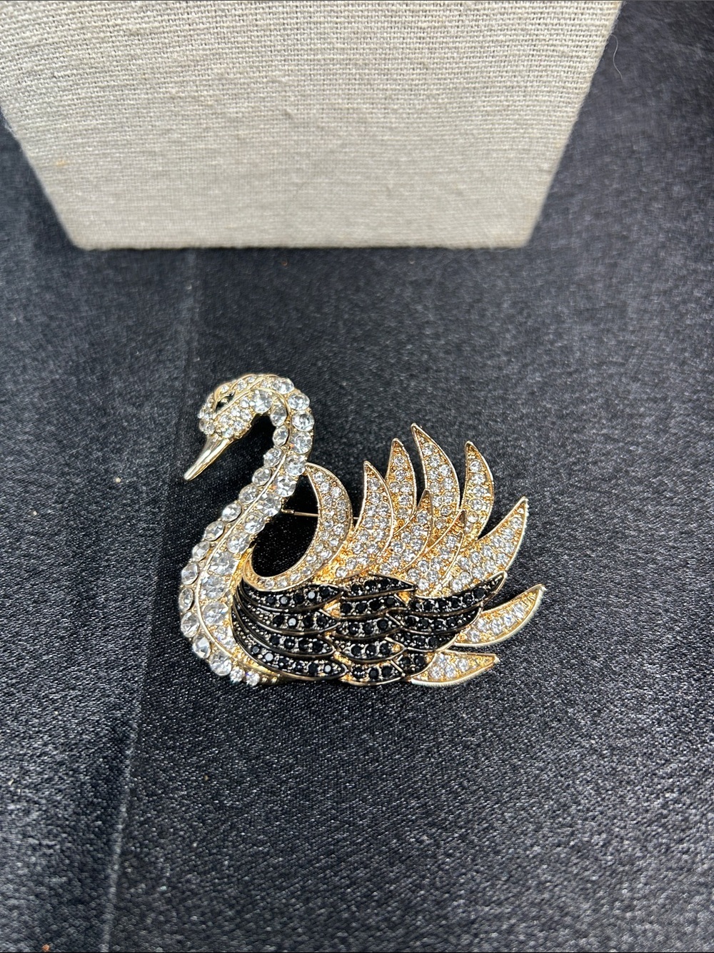 Gold-tone swan brooch/pendant with sparkling clear and black crystal rhinestones